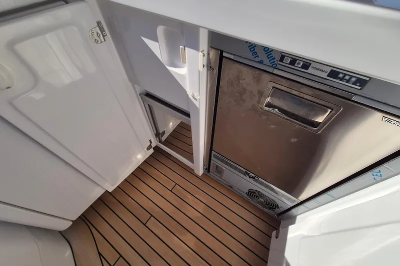  Yacht Photos Pics 2025 Azimut Grande 26M yacht interior with stainless steel appliance and wooden flooring.