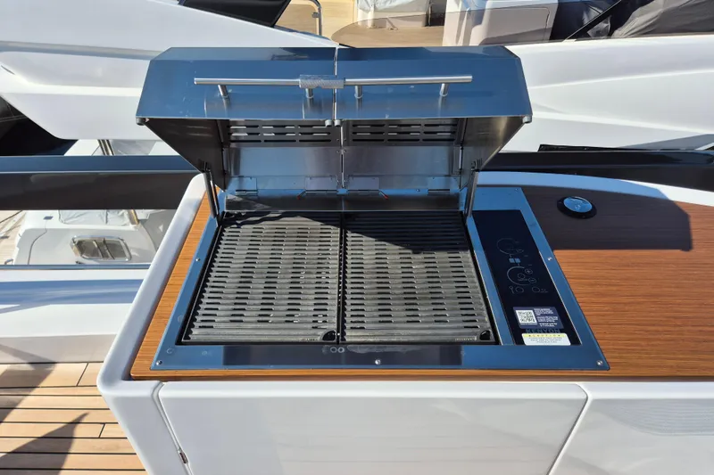  Yacht Photos Pics Outdoor grill on Azimut Grande 26M yacht, 2025 model, with sleek design and wooden accents.