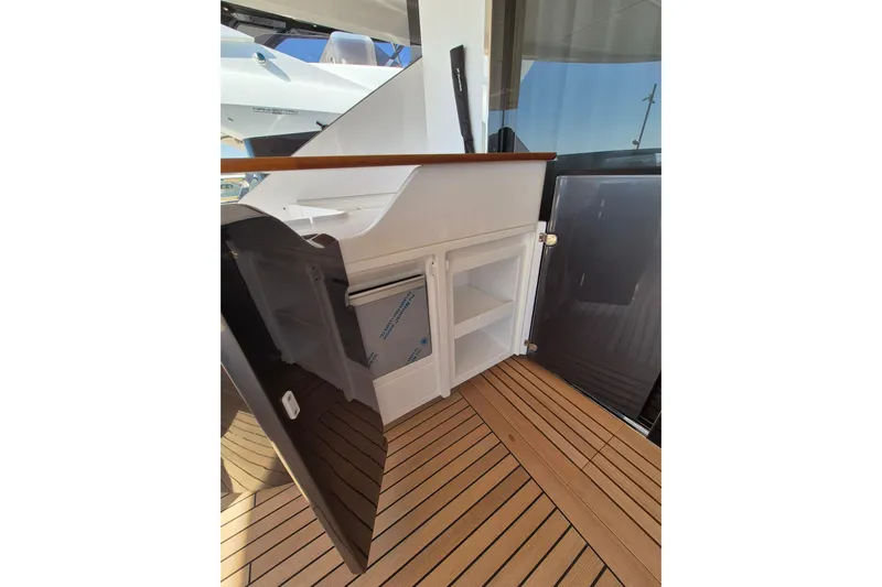  Yacht Photos Pics 2025 Azimut Grande 26M yacht interior with open storage compartments and sleek design.