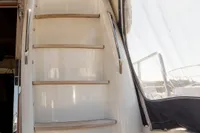 Staircase on 2010 Storebro 435 Commander yacht, leading to upper deck, with sleek design.