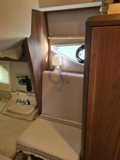 P Yacht Photos Pics Interior of 2018 Sealine C330 yacht cabin with cozy seating and window.