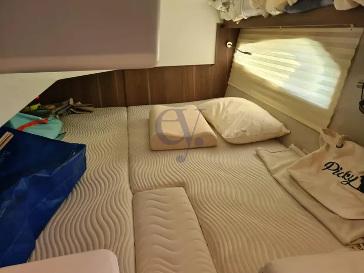 P Yacht Photos Pics Cozy cabin interior of 2018 Sealine C330 yacht with comfortable bedding and storage.