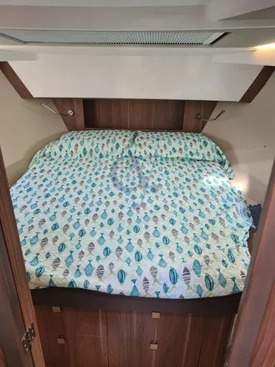 P Yacht Photos Pics 2018 Sealine C330 cabin with patterned bedding, wooden accents, and modern design.