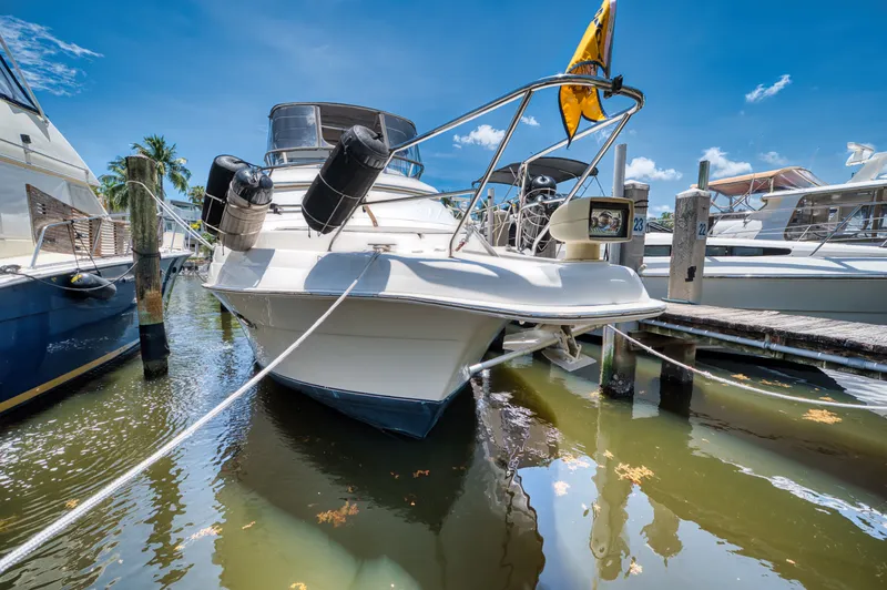 Turn The Paige Yacht Photos Pics 2003 Silverton 43 Motor Yacht docked in sunny marina.