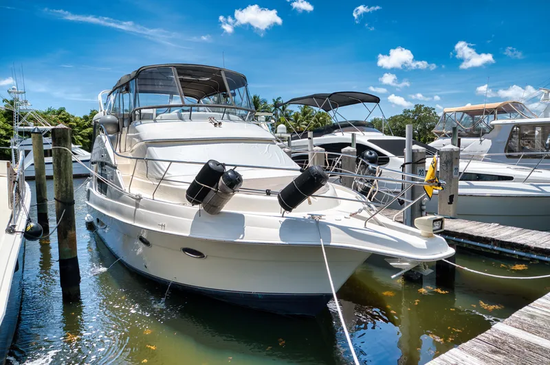 Turn The Paige Yacht Photos Pics 2003 Silverton 43 Motor Yacht docked in sunny marina.