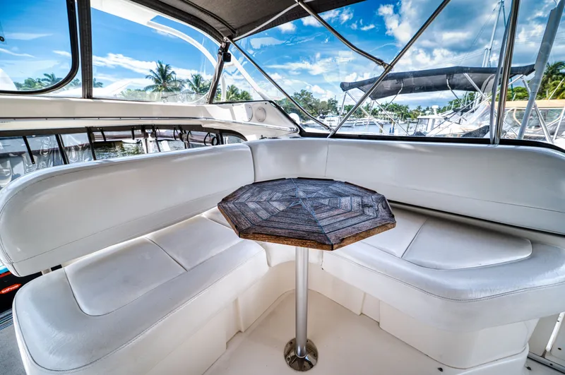 Turn The Paige Yacht Photos Pics Interior of 2003 Silverton 43 Motor Yacht with seating area.