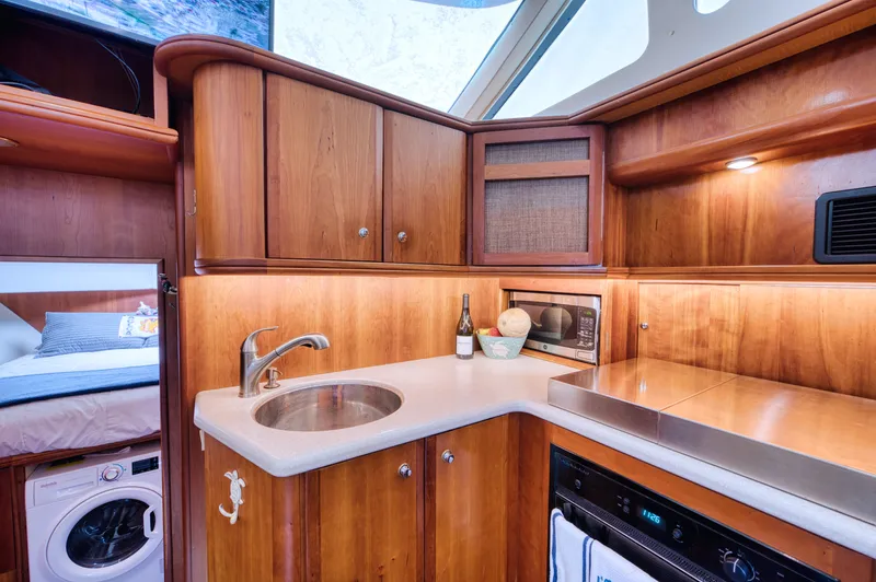 Turn The Paige Yacht Photos Pics Interior of 2003 Silverton 43 Motor Yacht with modern kitchen.