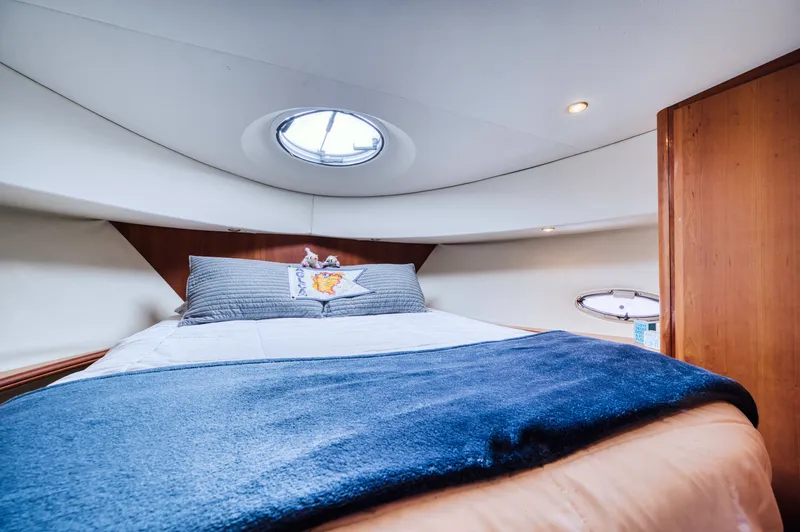 Turn The Paige Yacht Photos Pics Interior of 2003 Silverton 43 Motor Yacht with cozy bed.