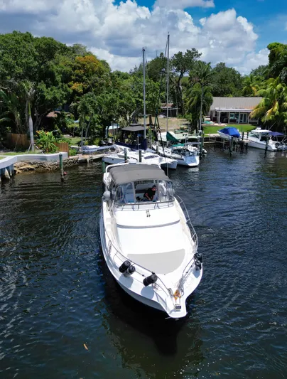Turn The Paige Yacht Photos Pics 2003 Silverton 43 Motor Yacht on a serene river.