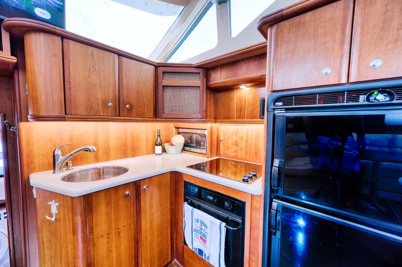 Turn The Paige Yacht Photos Pics Kitchen area of the 2003 Silverton 43 Motor Yacht.