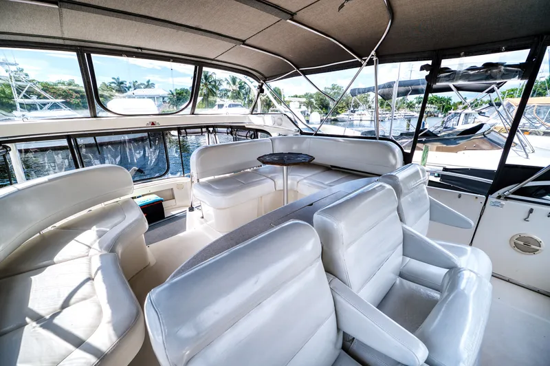 Turn The Paige Yacht Photos Pics Interior of a 2003 Silverton 43 Motor Yacht with white leather seating.