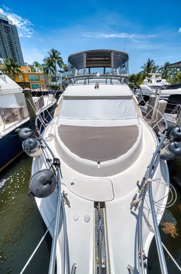 Turn The Paige Yacht Photos Pics 2003 Silverton 43 Motor Yacht docked on a sunny day.