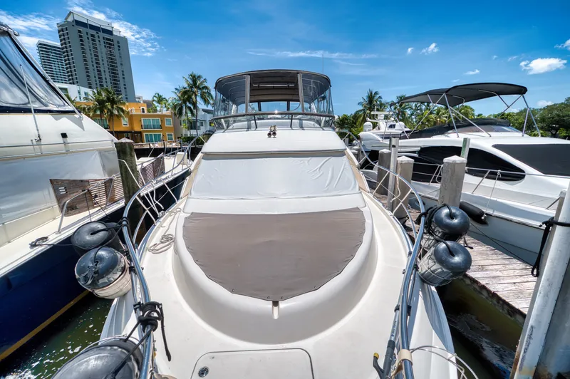 Turn The Paige Yacht Photos Pics 2003 Silverton 43 Motor Yacht docked on a sunny day.