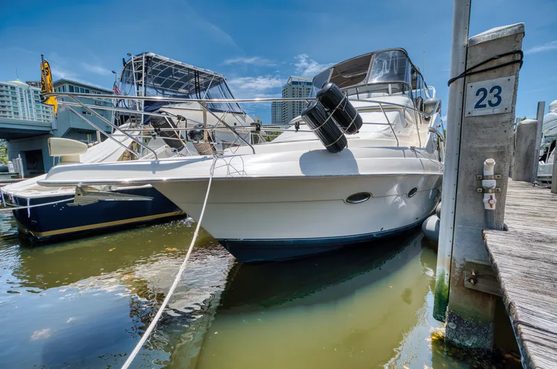 Turn The Paige Yacht Photos Pics 2003 Silverton 43 Motor Yacht docked on a sunny day.