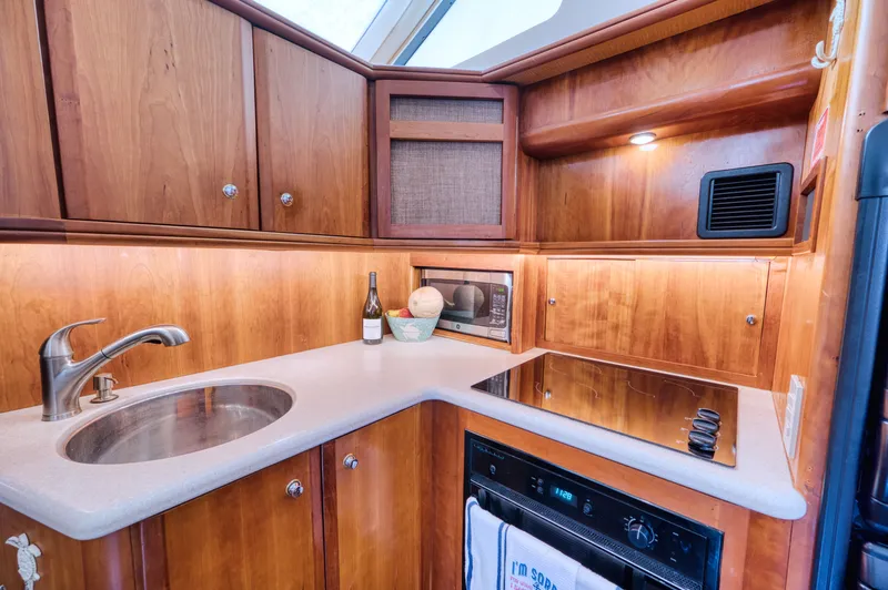 Turn The Paige Yacht Photos Pics Kitchen area of the 2003 Silverton 43 Motor Yacht.