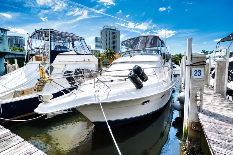 Turn The Paige Yacht Photos Pics 2003 Silverton 43 Motor Yacht docked on a sunny day.