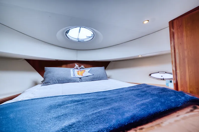 Turn The Paige Yacht Photos Pics Interior of 2003 Silverton 43 Motor Yacht, cozy bedroom with skylight.