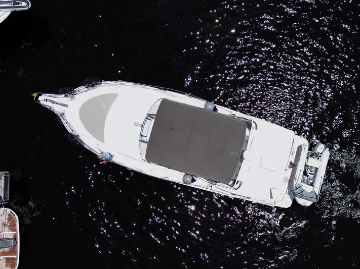 Turn The Paige Yacht Photos Pics Aerial view of a 2003 Silverton 43 Motor Yacht on the water.