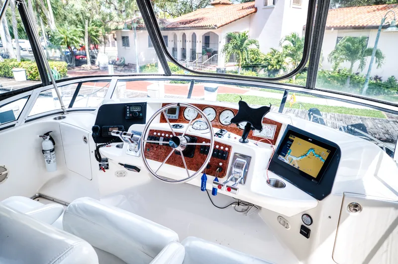 Turn The Paige Yacht Photos Pics 2003 Silverton 43 Motor Yacht helm with navigation system.