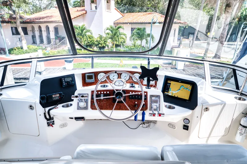 Turn The Paige Yacht Photos Pics 2003 Silverton 43 Motor Yacht helm with navigation system.