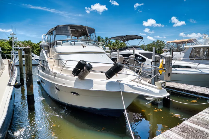 Turn The Paige Yacht Photos Pics 2003 Silverton 43 Motor Yacht docked in sunny marina.