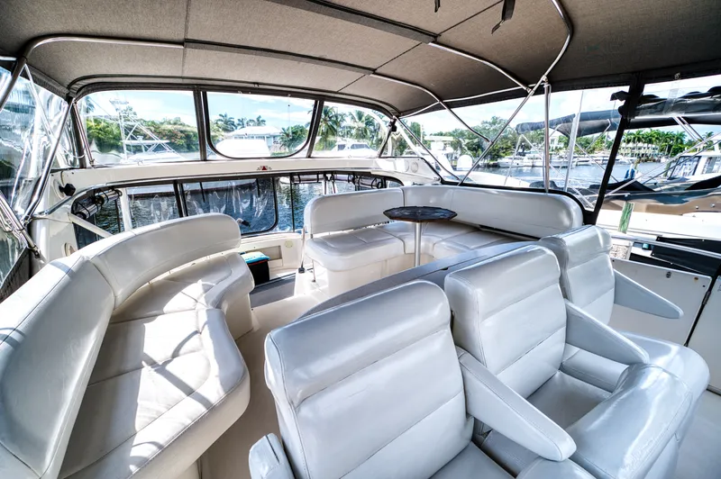 Turn The Paige Yacht Photos Pics Interior of 2003 Silverton 43 Motor Yacht with white leather seating.