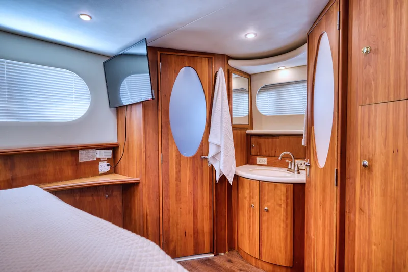 Turn The Paige Yacht Photos Pics Interior of 2003 Silverton 43 Motor Yacht with wood paneling.