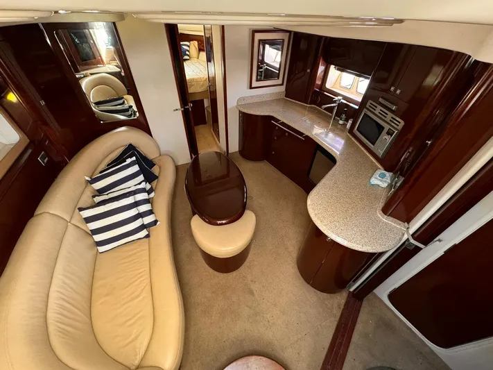 The Boardroom Yacht Photos Pics Luxurious 2008 Sea Ray Sundancer interior with elegant seating and modern kitchen amenities.