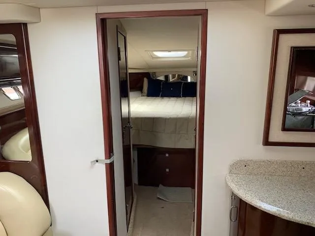 The Boardroom Yacht Photos Pics 2008 Sea Ray Sundancer cabin interior with bed, mirror, and countertop.