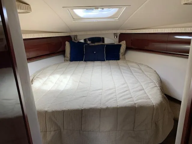 The Boardroom Yacht Photos Pics Luxurious cabin interior of a 2008 Sea Ray Sundancer yacht with a cozy bed.