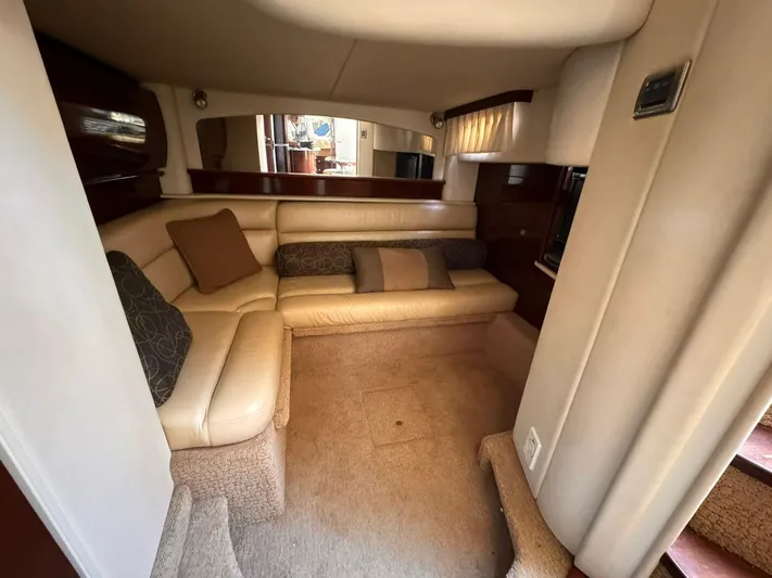 The Boardroom Yacht Photos Pics Luxurious interior of a 2008 Sea Ray Sundancer yacht with beige seating and cushions.