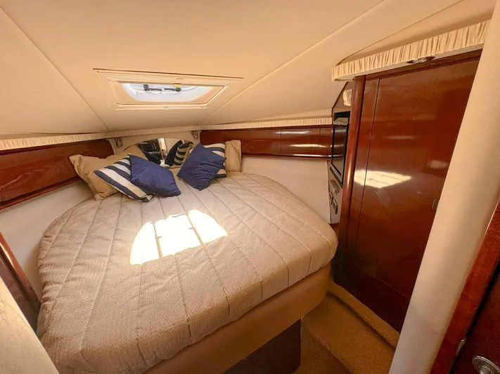 The Boardroom Yacht Photos Pics Luxurious cabin interior of 2008 Sea Ray Sundancer with cozy bed and elegant wood finish.