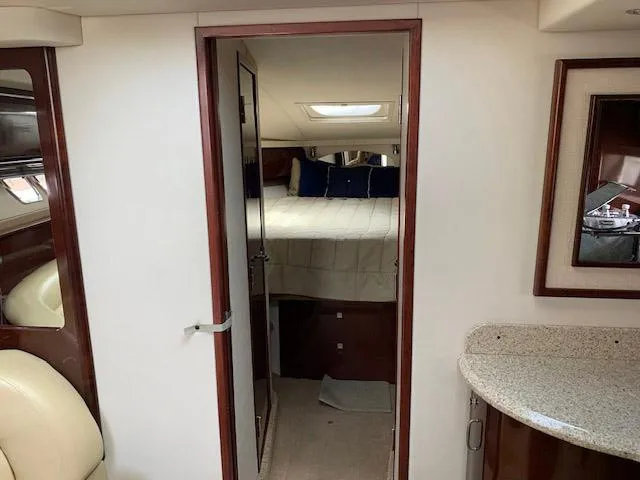 The Boardroom Yacht Photos Pics Interior cabin of 2008 Sea Ray Sundancer yacht with bed and modern furnishings.