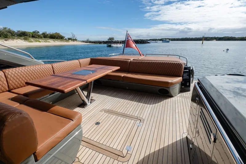 Zaza Yacht Photos Pics Luxurious 2013 Sunseeker Predator 68 yacht deck with elegant seating and scenic water view.