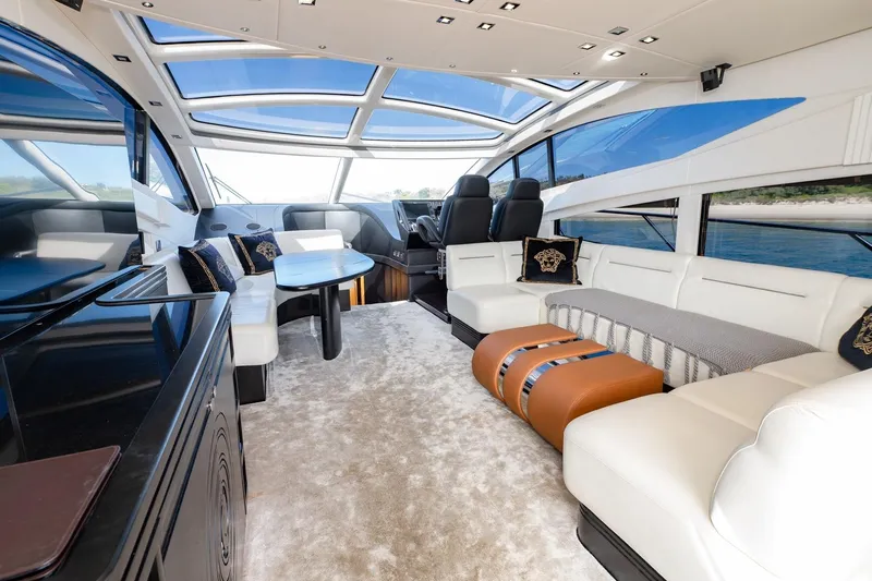 Zaza Yacht Photos Pics Luxurious interior of 2013 Sunseeker Predator 68 yacht with elegant seating and panoramic windows.