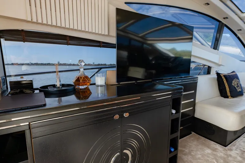 Zaza Yacht Photos Pics Luxurious interior of 2013 Sunseeker Predator 68 yacht with elegant decor and large TV.