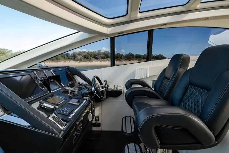 Zaza Yacht Photos Pics Luxurious cockpit of 2013 Sunseeker Predator 68 yacht with advanced navigation controls.