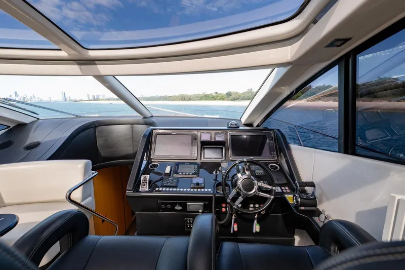 Zaza Yacht Photos Pics Luxurious 2013 Sunseeker Predator 68 yacht cockpit with modern navigation controls and panoramic views.