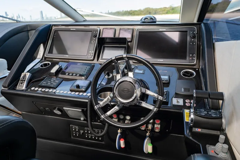 Zaza Yacht Photos Pics Cockpit of 2013 Sunseeker Predator 68 yacht with advanced navigation controls and steering wheel.