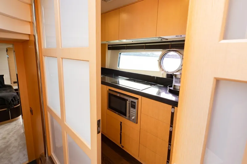 Zaza Yacht Photos Pics Interior view of 2013 Sunseeker Predator 68 yacht kitchen with modern appliances.