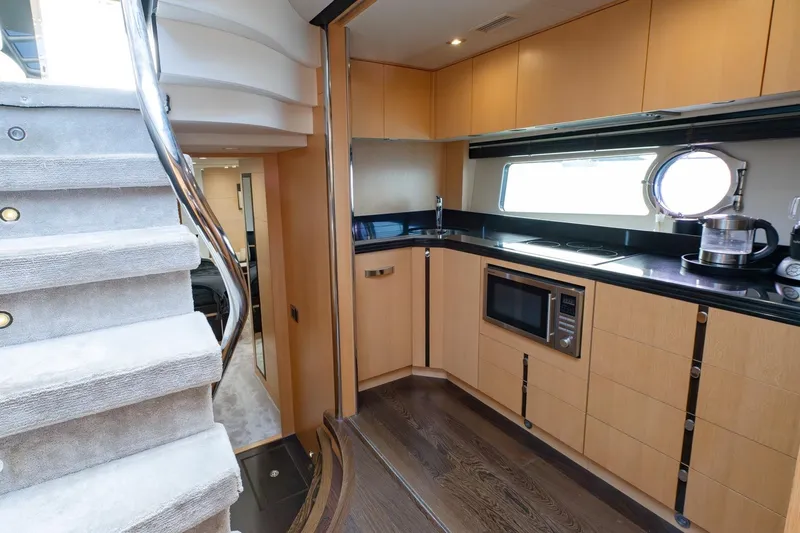 Zaza Yacht Photos Pics Luxurious kitchen interior of 2013 Sunseeker Predator 68 yacht with modern appliances.
