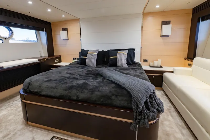 Zaza Yacht Photos Pics Luxurious bedroom interior on 2013 Sunseeker Predator 68 yacht, featuring elegant design and cozy furnishings.