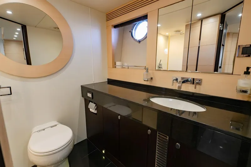 Zaza Yacht Photos Pics Luxurious bathroom in 2013 Sunseeker Predator 68 yacht, featuring modern fixtures and elegant design.