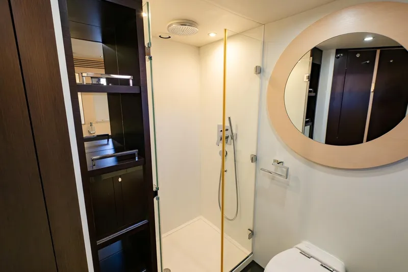 Zaza Yacht Photos Pics Luxurious bathroom in 2013 Sunseeker Predator 68 yacht, featuring modern shower and elegant design.