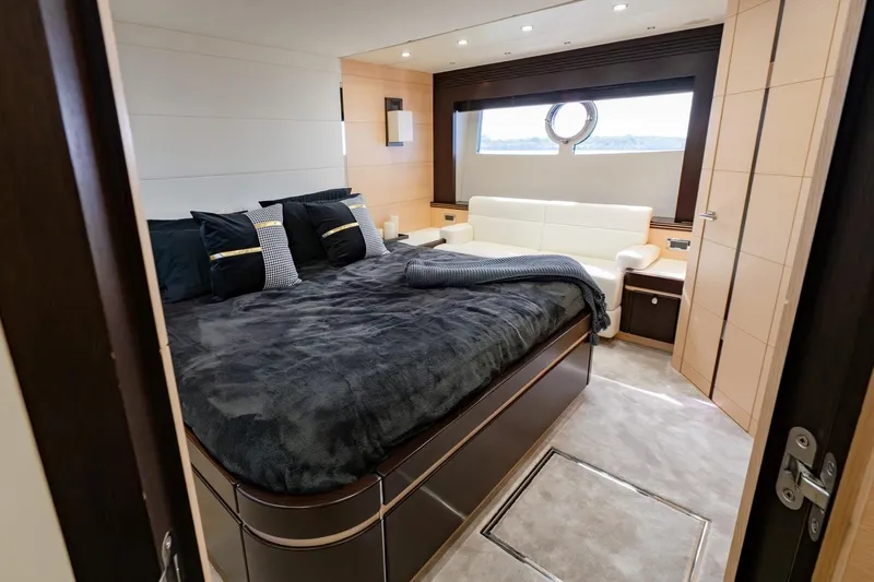 Zaza Yacht Photos Pics Luxurious bedroom interior of 2013 Sunseeker Predator 68 yacht with elegant furnishings.