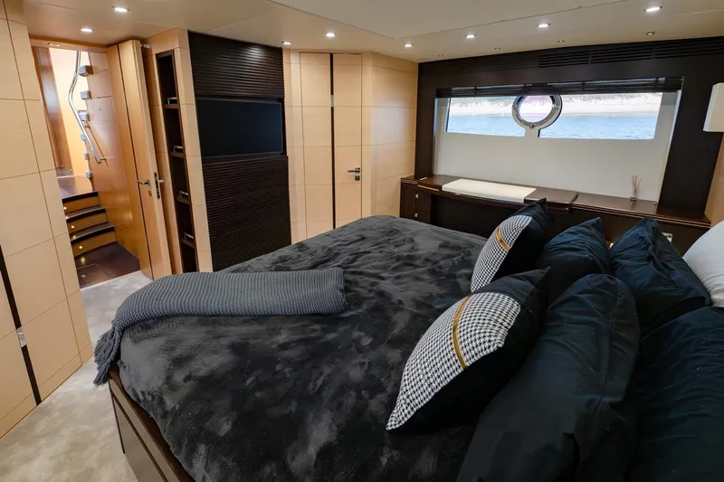 Zaza Yacht Photos Pics Luxurious bedroom interior of 2013 Sunseeker Predator 68 yacht with elegant decor and sea view.