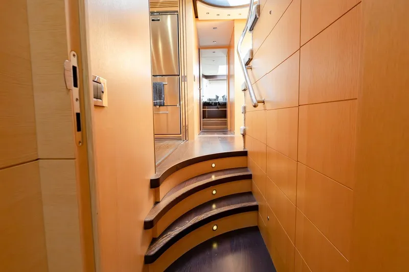 Zaza Yacht Photos Pics Luxurious interior of 2013 Sunseeker Predator 68 yacht with elegant wooden staircase.