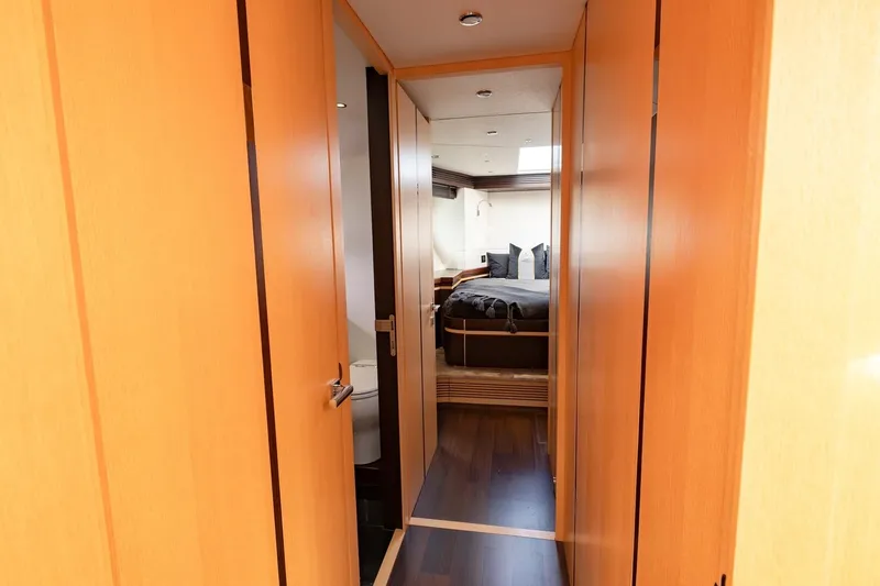 Zaza Yacht Photos Pics Luxurious cabin interior of 2013 Sunseeker Predator 68 yacht, featuring elegant wood finishes.