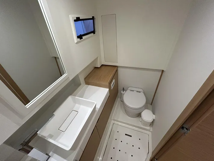 M/y Wavemoji Yacht Photos Pics Modern bathroom in 2022 Pardo Yachts 38, featuring sleek sink and compact toilet.