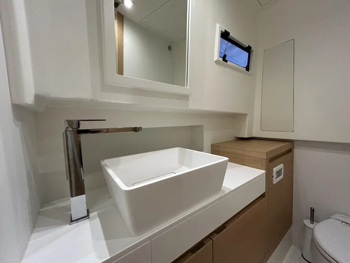 M/y Wavemoji Yacht Photos Pics Modern bathroom interior of 2022 Pardo Yachts 38, featuring sleek sink and minimalist design.